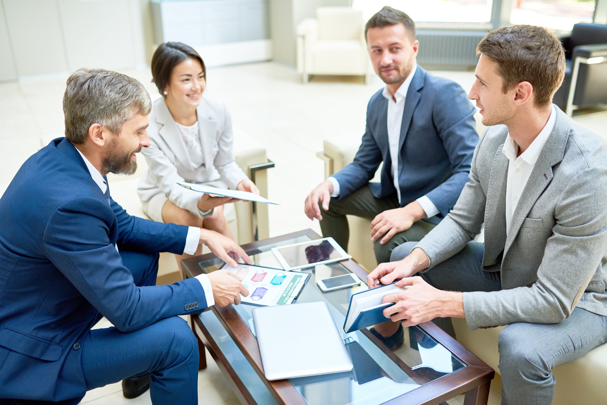 team of cheerful business people in meeting.jpg